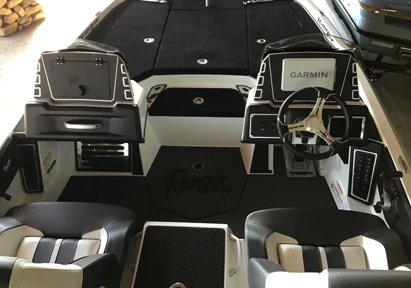 Slide: The Image of 2025 Ranger Z519R Cup-Equipped boat interior with Garmin system and dual seating. - 2