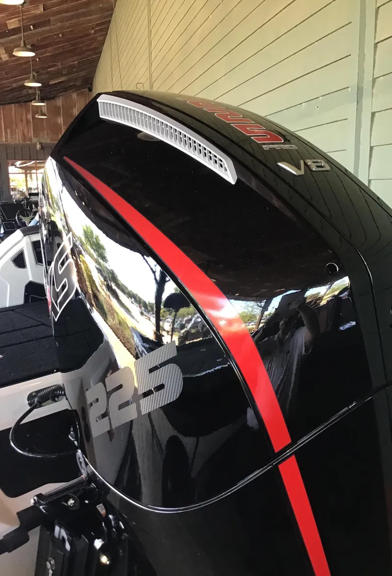 Slide: The Image of 2025 Ranger Z519R Cup-Equipped boat engine with sleek black and red design. - 3