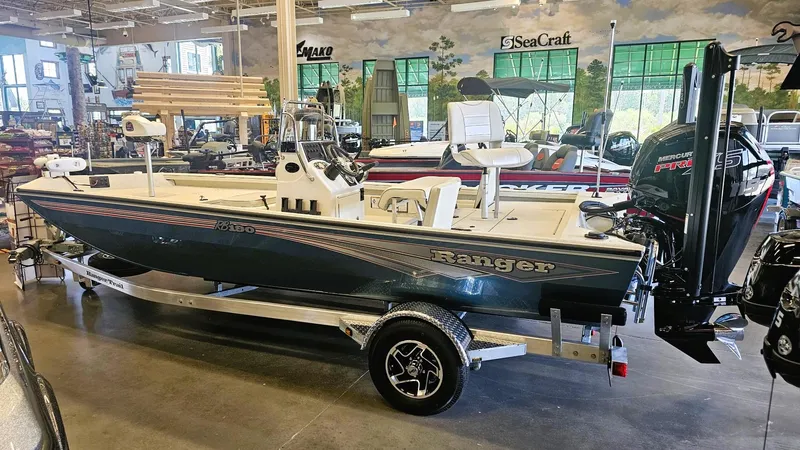 Slide: The Image of 2025 Ranger RB190 boat displayed indoors on a trailer. - 13