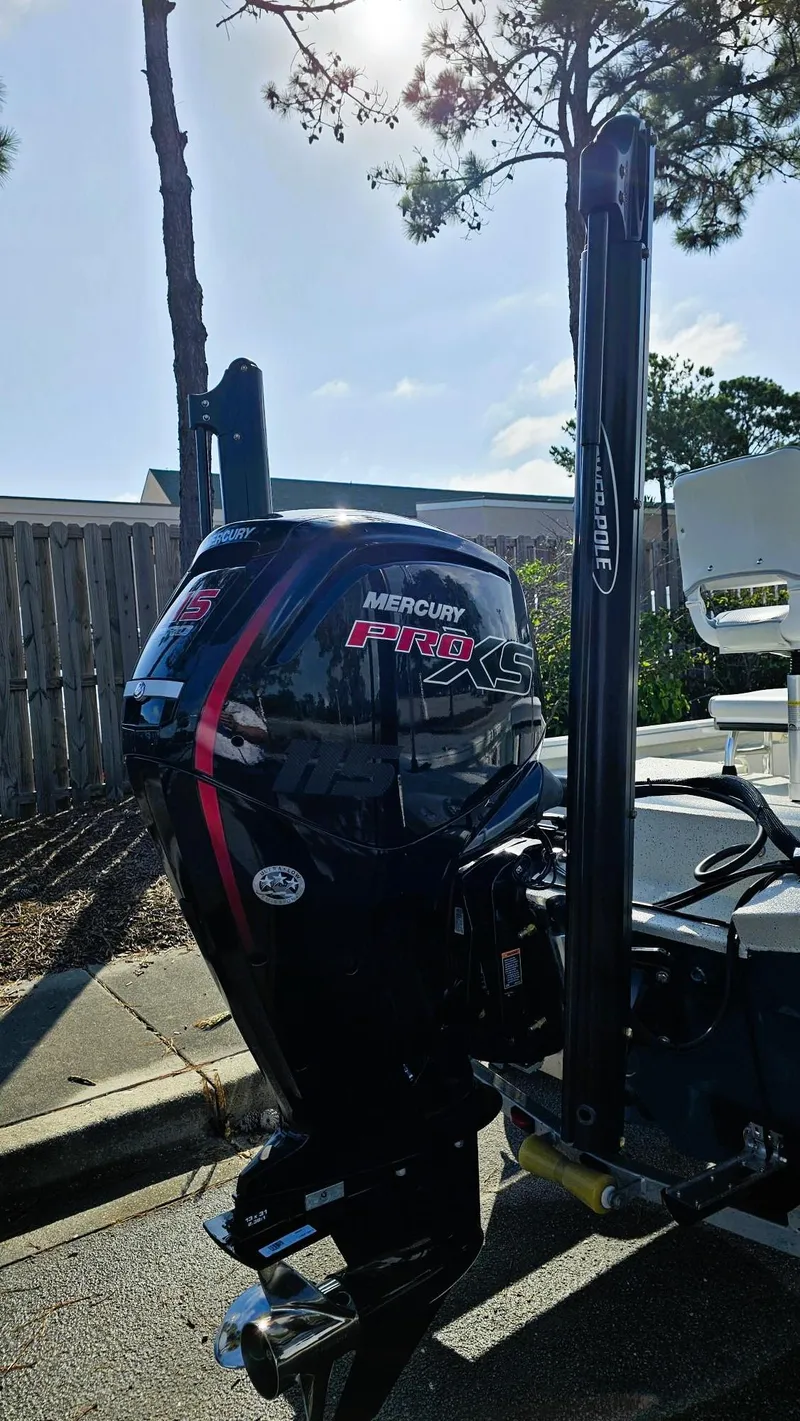 Slide: The Image of 2025 Ranger RB190 boat with Mercury Pro XS engine, parked outdoors under sunlight. - 4