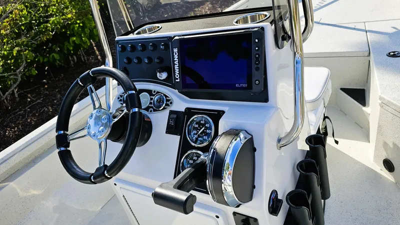 Slide: The Image of 2025 Ranger RB190 boat console with steering wheel and Lowrance electronics. - 9
