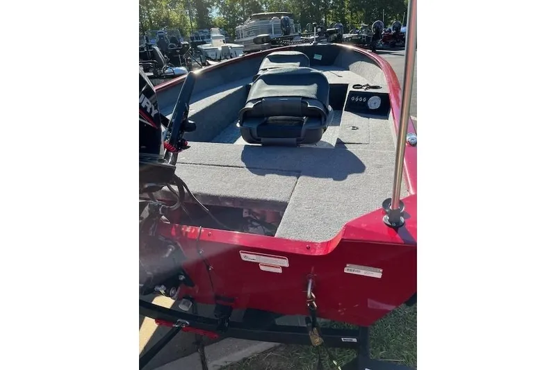 Slide: The Image of 2025 Tracker Super Guide V-16 SC boat interior with seating and control panel. - 2