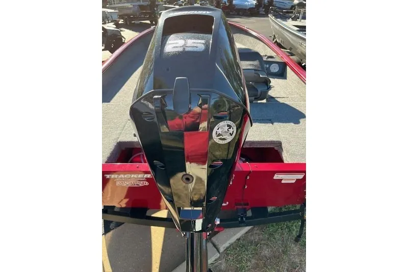Slide: The Image of 2025 Tracker Super Guide V-16 SC boat with a 25 HP outboard motor, red and gray interior. - 3