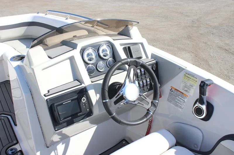 Slide: The Image of 2021 Starcraft SVX 191 OB boat dashboard with steering wheel and control panel. - 10