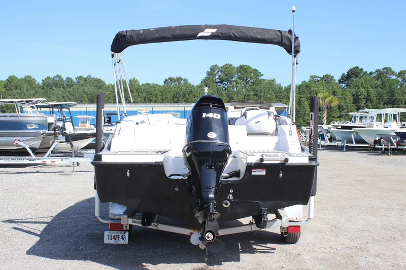 Slide: The Image of 2021 Starcraft SVX 191 OB boat with outboard motor, parked on a trailer. - 16