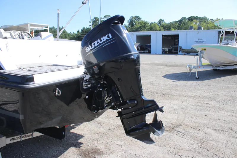 Slide: The Image of 2021 Starcraft SVX 191 OB boat with Suzuki outboard motor in a sunny outdoor setting. - 22