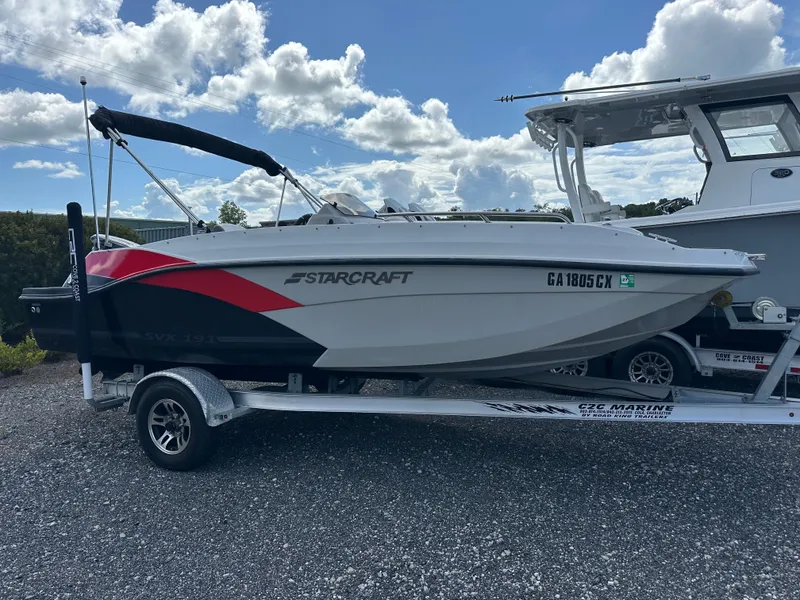 Slide: The Image of 2021 Starcraft SVX 191 OB boat on trailer under cloudy sky. - 3