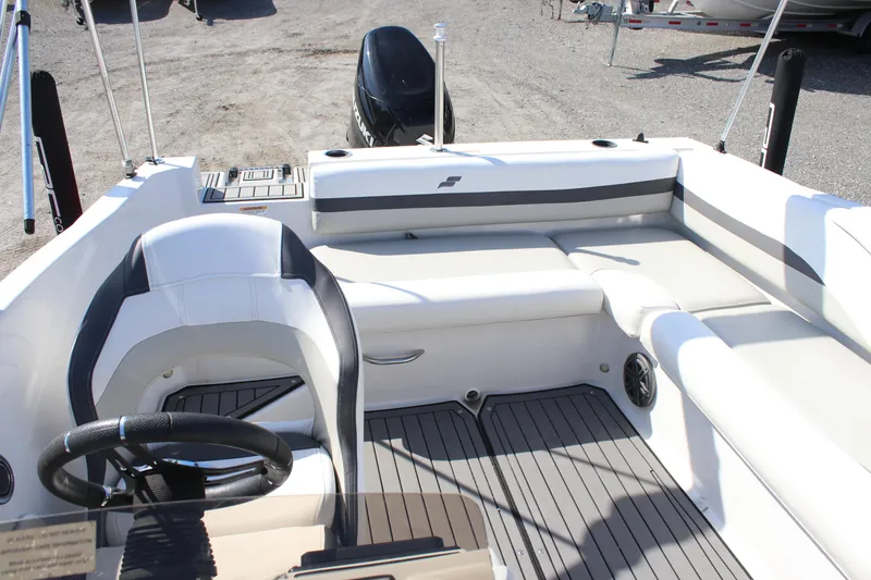 Slide: The Image of 2021 Starcraft SVX 191 OB boat interior with seating and steering wheel. - 6