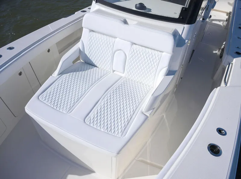 Slide: The Image of Luxurious seating on 2025 Solace 37 CS boat with diamond-pattern upholstery. - 10