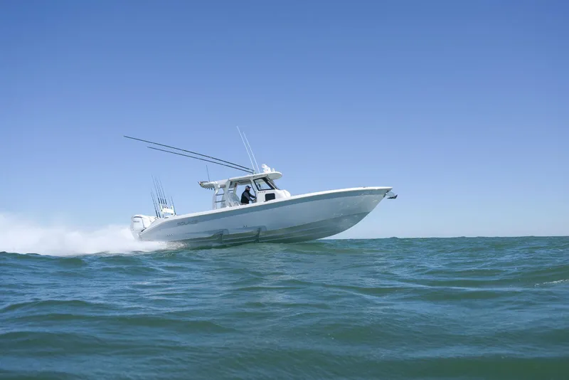 Slide: The Image of 2025 Solace 37 CS boat cruising on open water under clear blue sky. - 3