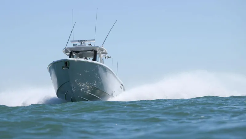 Slide: The Image of 2025 Solace 37 CS boat cruising swiftly on open water. - 4
