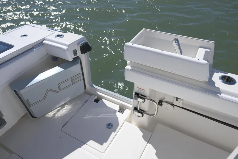 Slide: The Image of 2025 Solace 37 CS boat deck with storage and sink, overlooking water. - 8