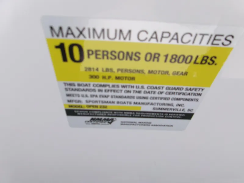 Slide: The Image of 2026 Sportsman Open 232 Center Console capacity label: 10 persons or 1800 lbs, 300 HP motor. - 16