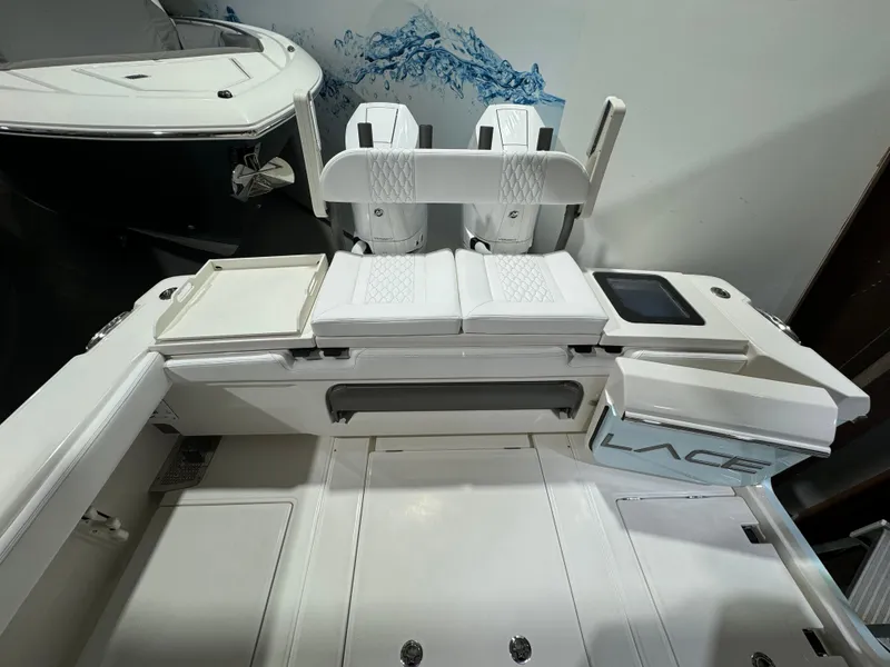 Slide: The Image of 2025 Solace 32 CS boat interior with dual seats and modern design. - 16