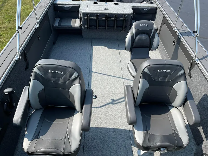 Slide: The Image of 2026 Lund 2075 Fisherman boat interior with two black and gray seats. - 10