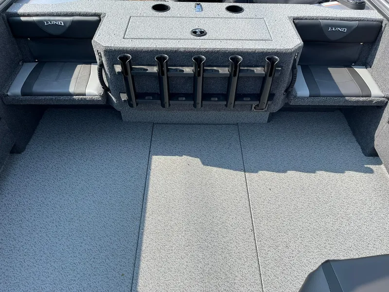 Slide: The Image of 2026 Lund 2075 Fisherman boat interior with rod holders and seating. - 11