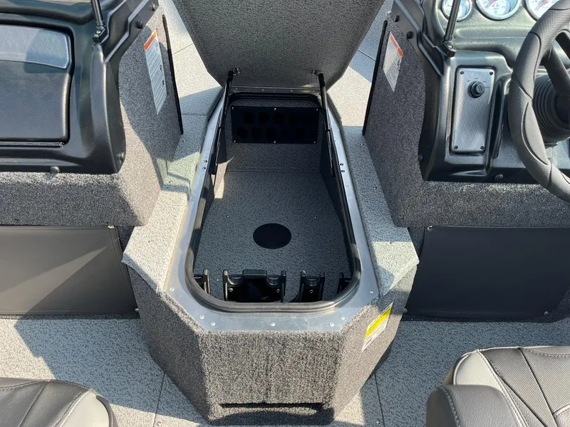 Slide: The Image of 2026 Lund 2075 Fisherman boat interior storage compartment with open lid. - 17