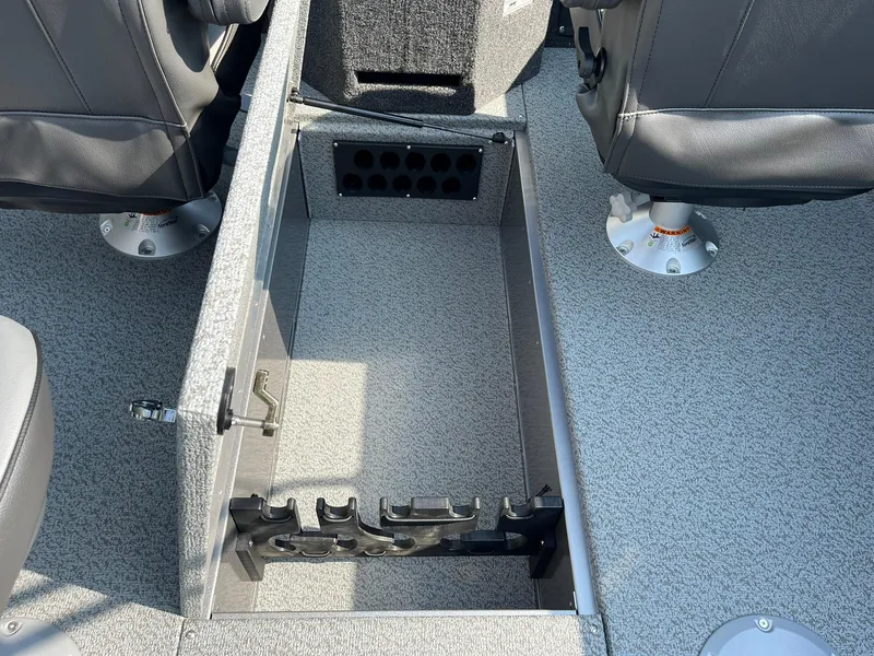 Slide: The Image of 2026 Lund 2075 Fisherman boat interior with open storage compartment and seating. - 18