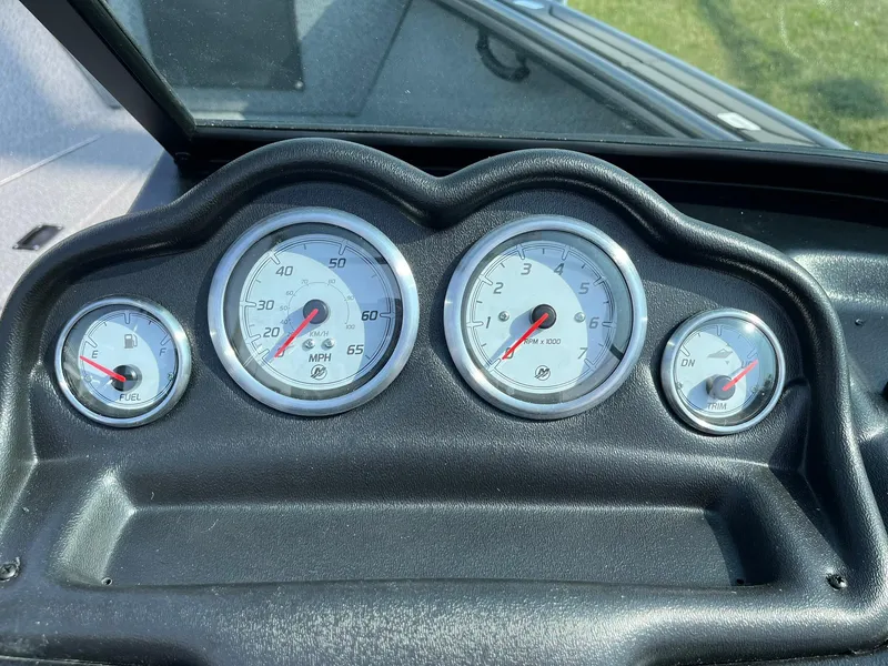 Slide: The Image of Dashboard of 2026 Lund 2075 Fisherman boat with fuel, speed, RPM, and trim gauges. - 22
