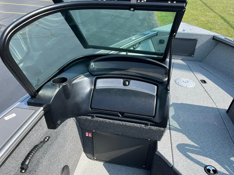 Slide: The Image of 2026 Lund 2075 Fisherman boat interior with windshield and storage compartment. - 25