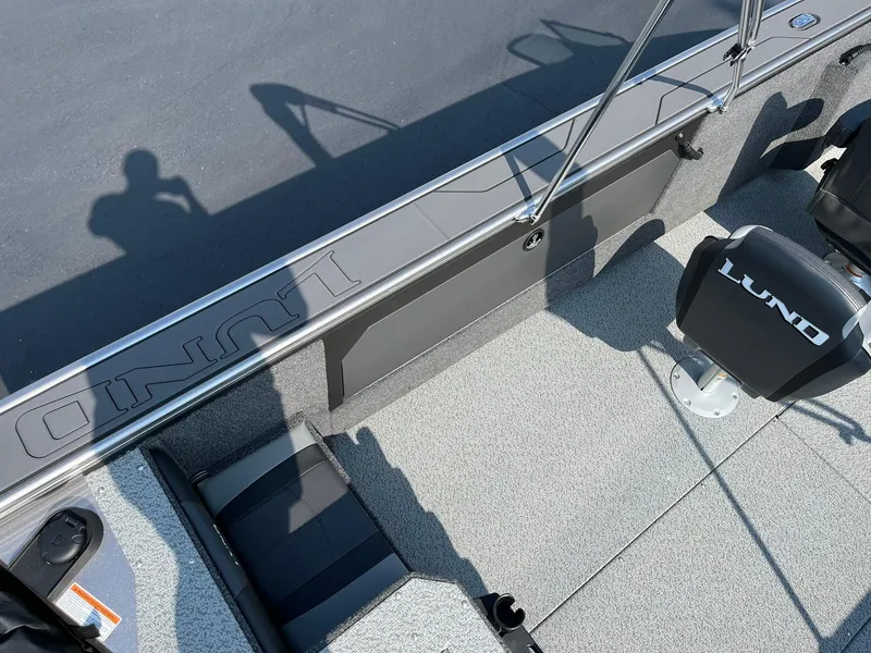 Slide: The Image of 2026 Lund 2075 Fisherman boat interior with seating and shadow on deck. - 29