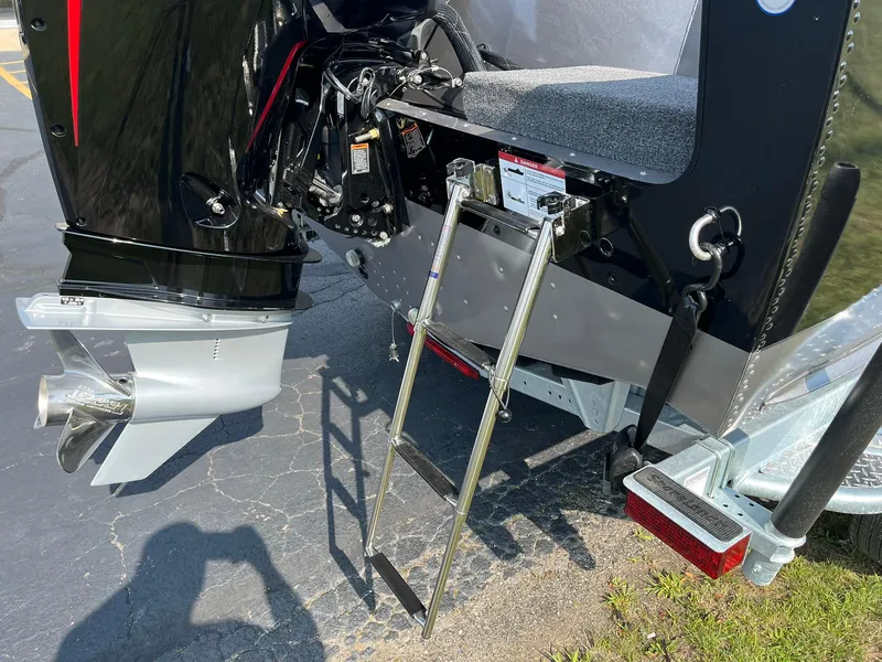 Slide: The Image of 2026 Lund 2075 Fisherman boat with ladder and outboard motor on trailer. - 39