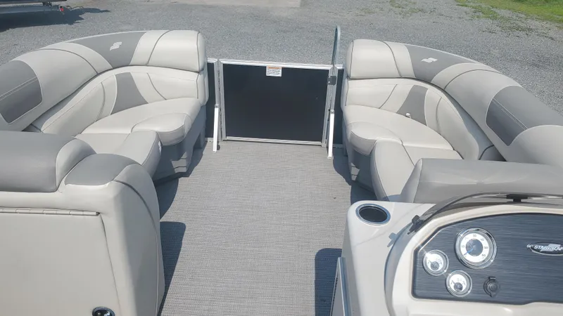 Slide: The Image of 2020 Starcraft EX 22 Q pontoon boat interior with gray seating and dashboard. - 5