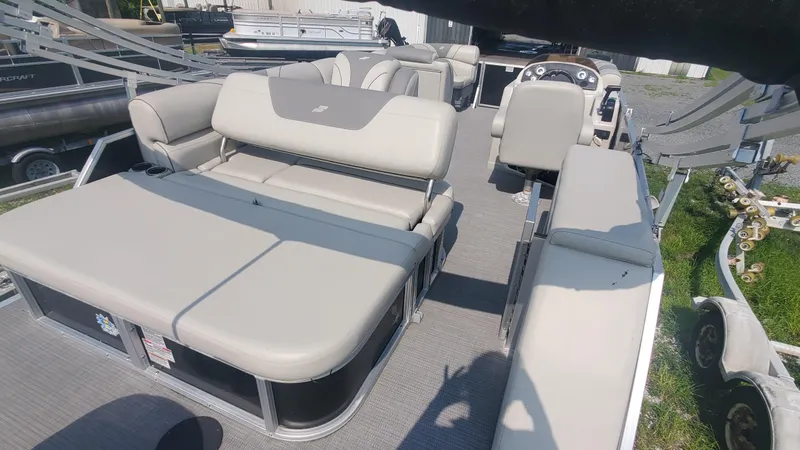 Slide: The Image of 2020 Starcraft EX 22 Q pontoon boat with spacious seating and modern design. - 7
