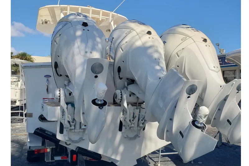 Slide: The Image of 2026 Regulator 35 boat with tan cover, docked outdoors. - 12