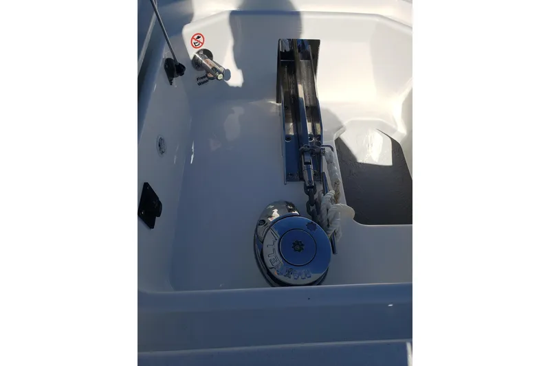 Slide: The Image of 2026 Regulator 35 boat dashboard with dual Garmin screens and steering wheel. - 17