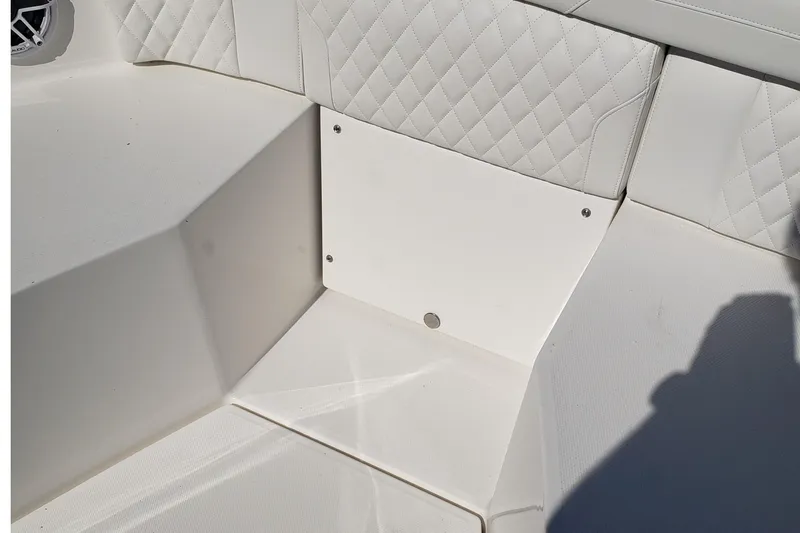 Slide: The Image of 2026 Regulator 35 boat dashboard with dual screens and steering wheel. - 18