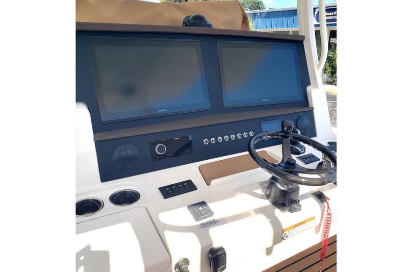 Slide: The Image of Luxury seating on 2026 Regulator 35 boat, featuring white cushioned seats and storage compartments. - 20