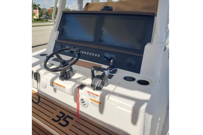 Slide: The Image of 2026 Regulator 35 boat with luxurious white seating and storage compartments. - 21