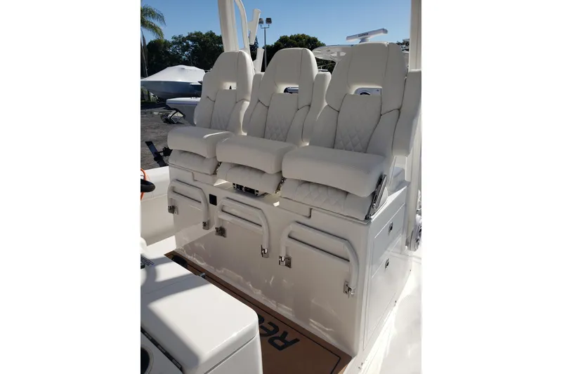 Slide: The Image of 2026 Regulator 35 boat livewell with open lid, showcasing interior design. - 24