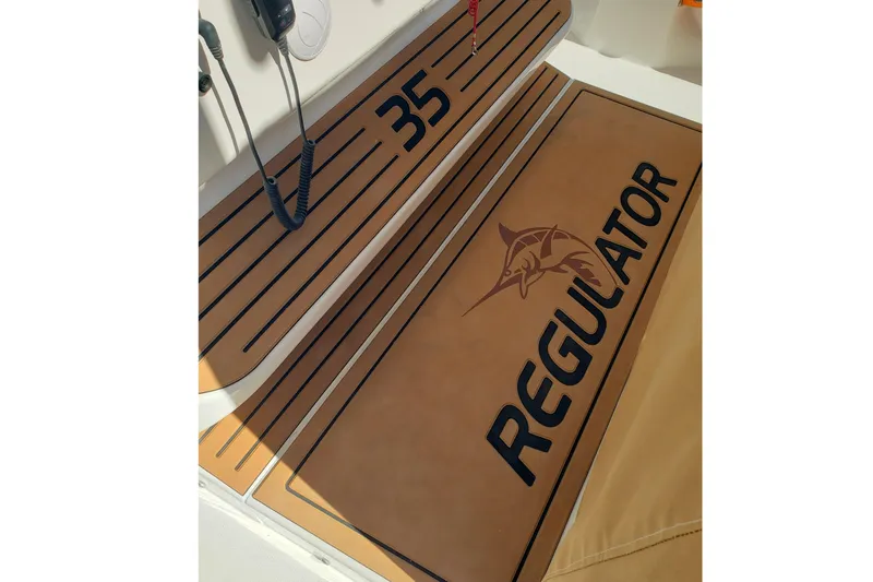 Slide: The Image of Electrical compartment of 2026 Regulator 35 boat, showcasing wiring and control panel. - 25