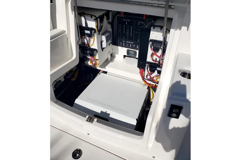 Slide: The Image of Regulator 35 boat storage compartment with equipment and blue buckets, 2026 model. - 28
