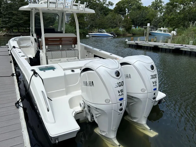 Slide: The Image of 2026 Pursuit S 288 boat with twin Yamaha 300 V6 engines docked by the water. - 3