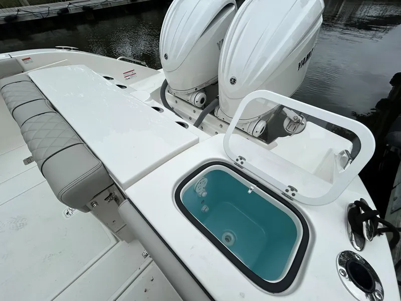 Slide: The Image of 2026 Pursuit S 288 boat with dual engines and open storage compartment. - 4