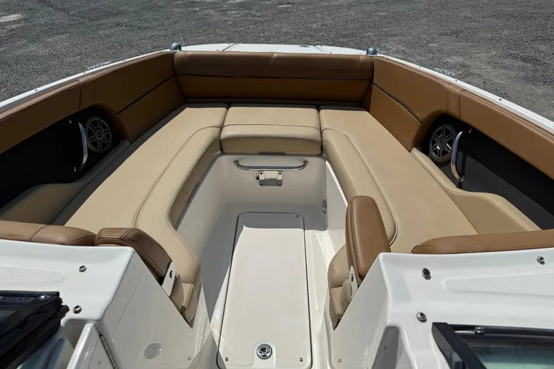 Slide: The Image of 2014 Sea Ray 240 Sundeck Outboard interior with spacious seating and modern design. - 2