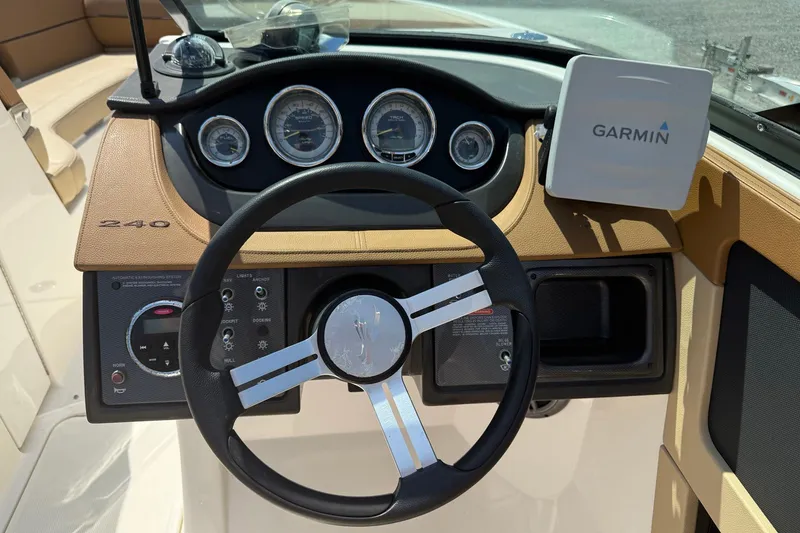 Slide: The Image of 2014 Sea Ray 240 Sundeck Outboard dashboard with Garmin navigation system. - 8