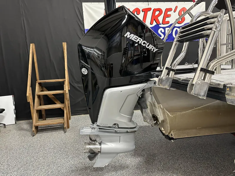 Slide: The Image of 2021 Barletta 23QCSS with Mercury Verado outboard motor in showroom. - 10