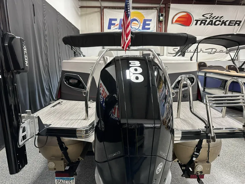 Slide: The Image of 2021 Barletta 23QCSS pontoon boat with Mercury 300 engine in showroom. - 12