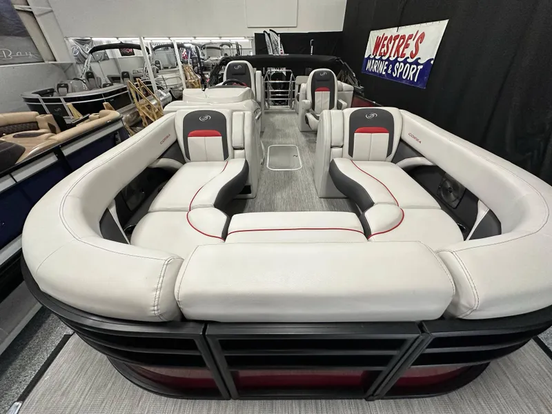 Slide: The Image of 2021 Barletta 23QCSS pontoon boat with luxurious seating in showroom. - 13