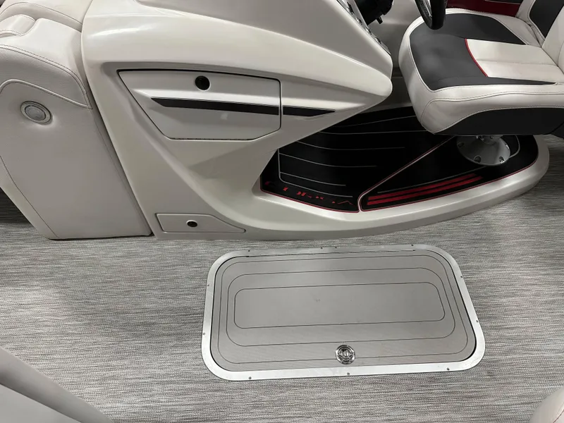 Slide: The Image of 2021 Barletta 23QCSS boat interior with seating and storage compartment. - 21