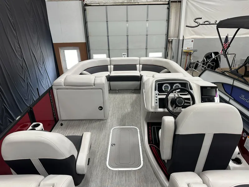 Slide: The Image of 2021 Barletta 23QCSS pontoon boat interior with plush seating and modern dashboard. - 31