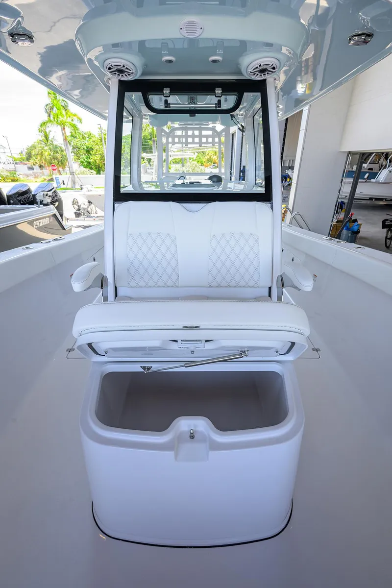 Slide: The Image of 2026 Sportsman Heritage 321 Center Console boat interior with seating and storage. - 12