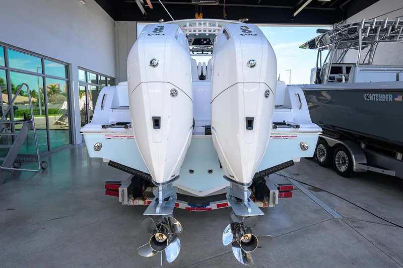 Slide: The Image of 2026 Sportsman Heritage 321 Center Console with dual outboard engines in showroom. - 22