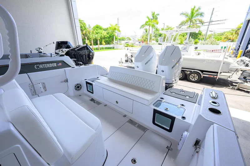 Slide: The Image of 2026 Sportsman Heritage 321 Center Console boat interior with dual Mercury engines. - 30