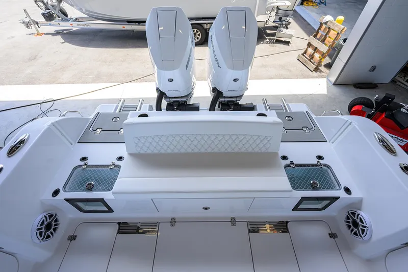 Slide: The Image of 2026 Sportsman Heritage 321 Center Console with dual outboard engines, viewed from above. - 31