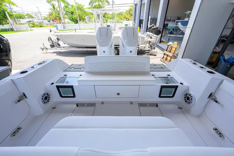 Slide: The Image of 2026 Sportsman Heritage 321 Center Console boat interior with seating and storage compartments. - 33